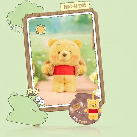 Small plush yellow bear with a red shirt and brown backpack standing on a soft outdoor path background