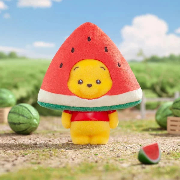 Strawberry slice plush keychain with yellow face, red body, and teal trim