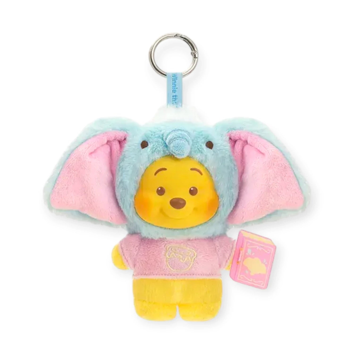 Blue and pink elephant-eared plush keychain with Pooh face, pink outfit, and pink book tag.
