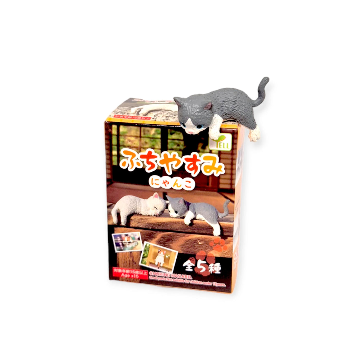 The Resting Cats Blind Box - Vol. 1 by Yell features a charming gray and white cat figure relaxing on top. This cute collectible includes images of different cat figures with Japanese text—collect all five delightful feline companions!