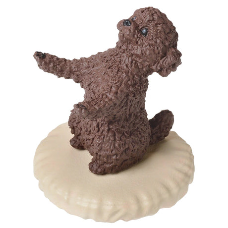 A small brown dog figurine from Yell's Pen Holding Dogs Blind Box sits elegantly on its hind legs atop a round beige platform, showcasing an exquisite example from this dog-themed collection.