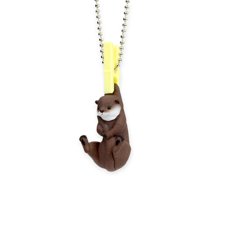 The Yell Washing Line Critters Charm Blind Box features a cute brown otter animal minifigure charm with a yellow clip and silver ball chain.