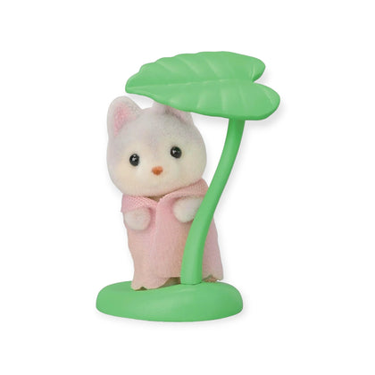 Sylvanian Families blind bag animal figure with pink coat and green leaf umbrella